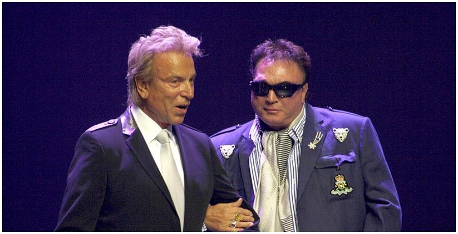 Siegfried and Roy on stage.