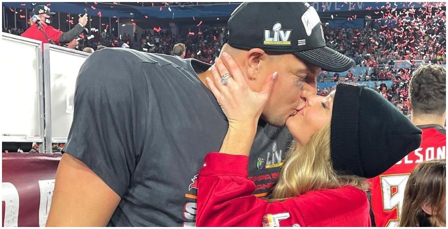 Rob Gronkowski and girlfriend Camille Kostek kiss at the Super Bowl.