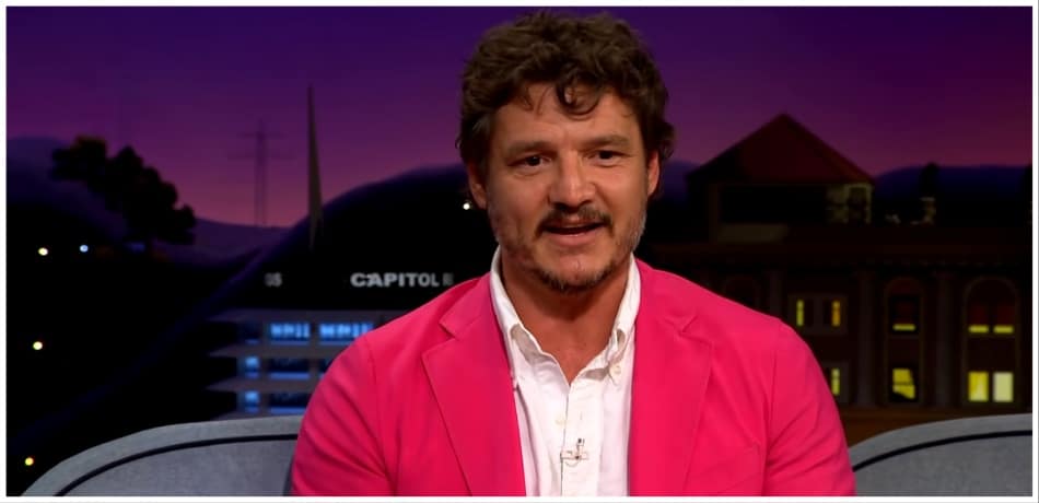 Pedro Pascal wearing a pink suit.