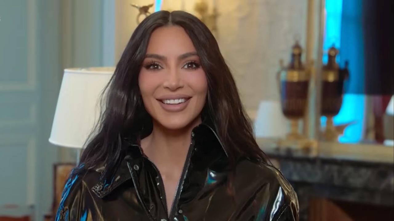 Kim Kardashian smiles in leather outfit