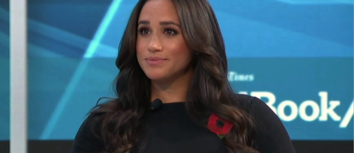 Meghan Markle in a black dress.