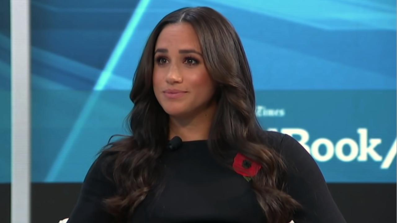 Meghan Markle in a black dress.