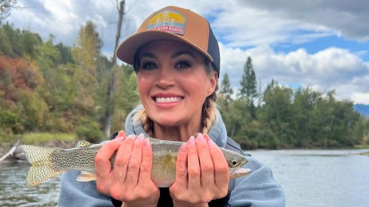 Carrie Underwood holding a fish